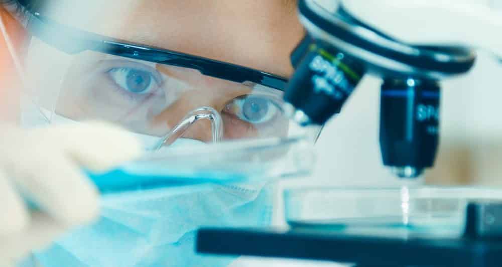 image of a researches with microscope