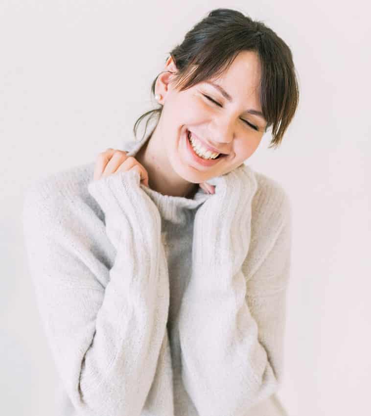 smiling girl in sweater
